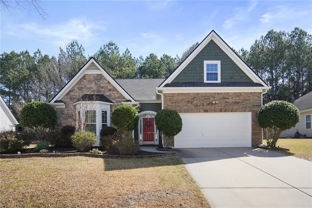 view of front of property featuring a front yard, concrete driveway, and brick siding