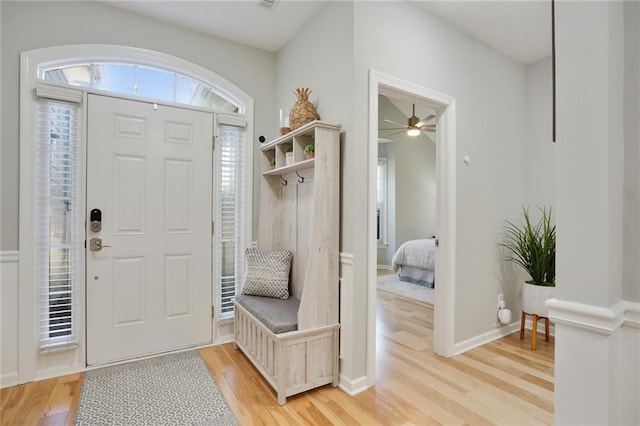 mudroom featuring light wood-type flooring, ceiling fan, and baseboards