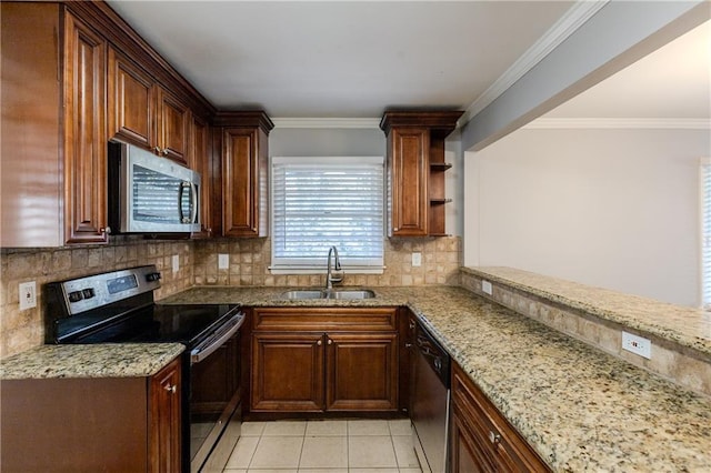 kitchen with sink, stainless steel appliances, decorative backsplash, light tile patterned floors, and ornamental molding