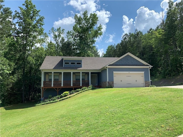 view of front facade with a front yard and a garage