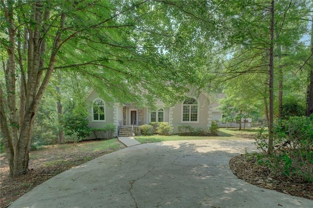 13935 Brown Bridge Rd, Covington, GA 30016 - view of property hidden behind natural elements with stucco siding