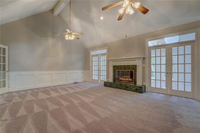 13935 Brown Bridge Rd, Covington, GA 30016 - unfurnished living room featuring a ceiling fan, carpet, french doors, beam ceiling, and high vaulted ceiling