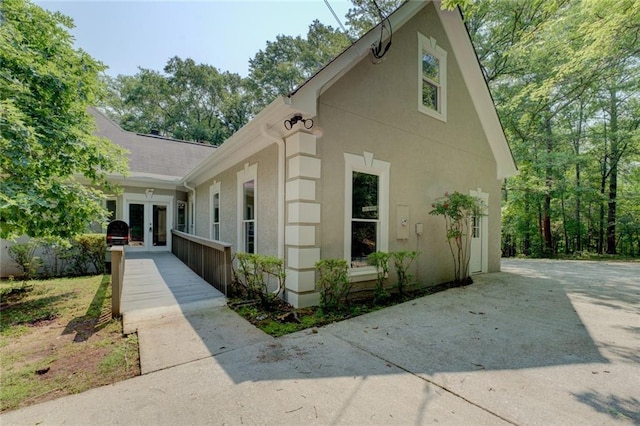 13935 Brown Bridge Rd, Covington, GA 30016 - view of front of property with french doors and stucco siding