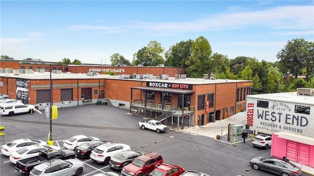 view of building exterior featuring uncovered parking