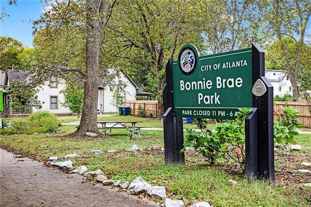 community sign with fence