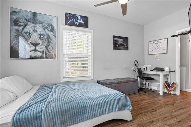 bedroom featuring wood finished floors and ceiling fan