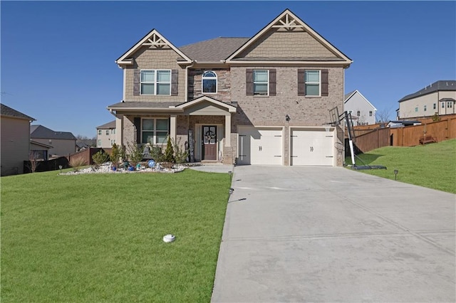 craftsman inspired home featuring a front lawn and a garage