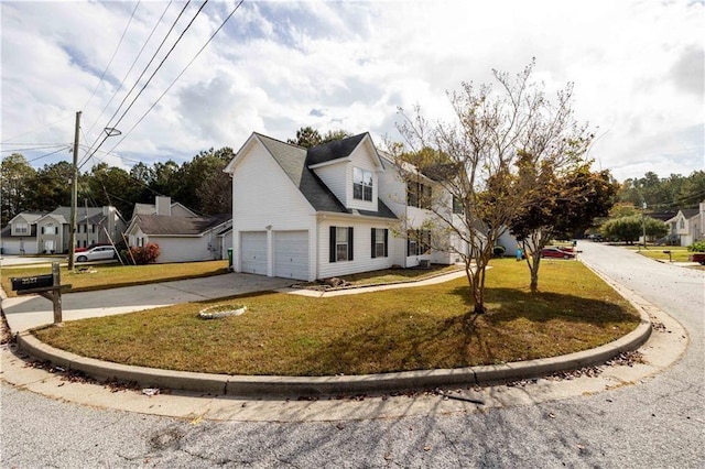 view of side of home with a garage and a yard