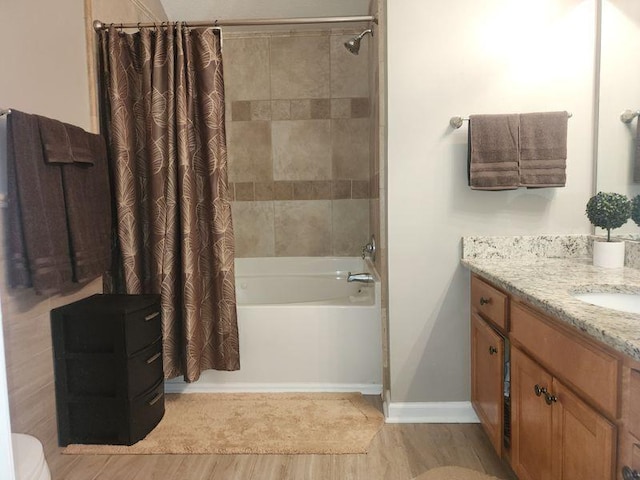 5449 Festival Ave, Fairburn, GA 30213 - bathroom featuring shower / bath combination with curtain, baseboards, wood finished floors, vanity, and toilet