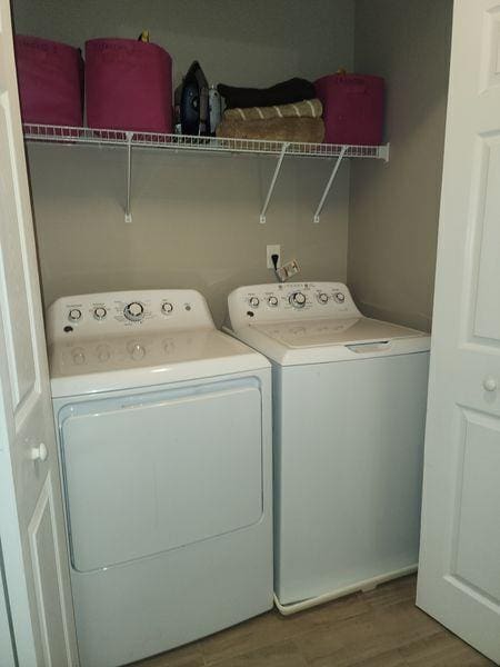 5449 Festival Ave, Fairburn, GA 30213 - washroom with separate washer and dryer and wood finished floors