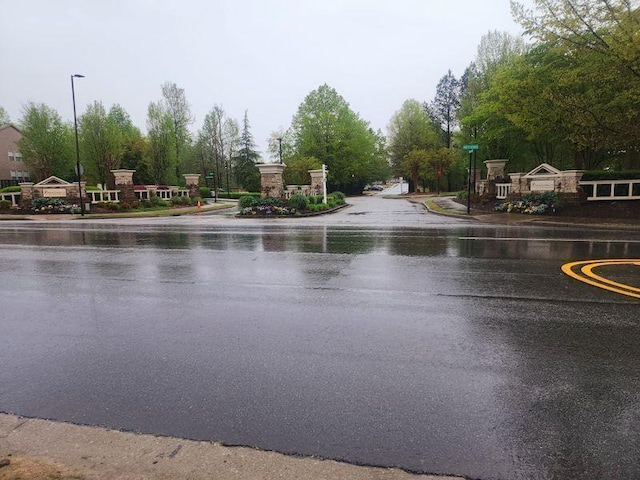 5449 Festival Ave, Fairburn, GA 30213 - view of asphalt road featuring street lighting and a water view