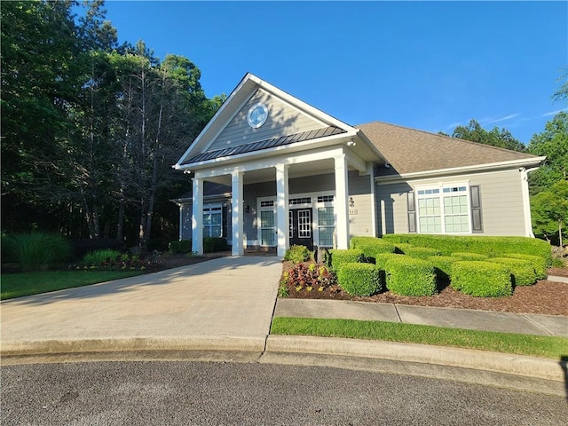 5449 Festival Ave, Fairburn, GA 30213 - neoclassical / greek revival house with a standing seam roof, a porch, and metal roof