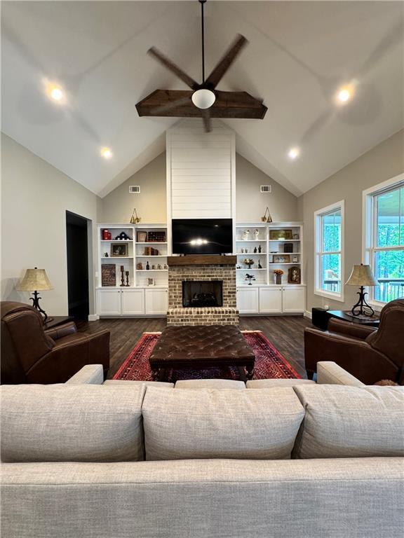 112 Three Oaks Dr SE, Calhoun, GA 30701 - living room featuring dark wood finished floors, a ceiling fan, high vaulted ceiling, a fireplace, and recessed lighting