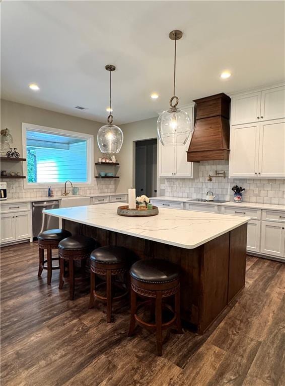 112 Three Oaks Dr SE, Calhoun, GA 30701 - kitchen with custom range hood, dishwasher, backsplash, a kitchen island, and black electric cooktop