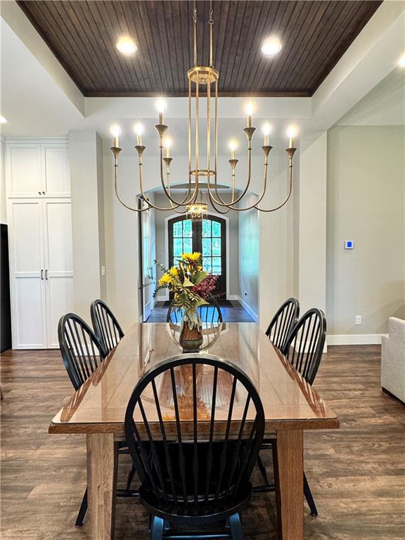 112 Three Oaks Dr SE, Calhoun, GA 30701 - dining space with dark wood-type flooring, a chandelier, wood ceiling, recessed lighting, and a raised ceiling