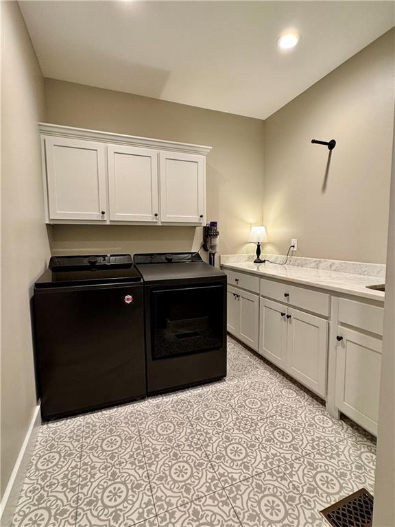 112 Three Oaks Dr SE, Calhoun, GA 30701 - washroom with cabinet space, washer and clothes dryer, and recessed lighting