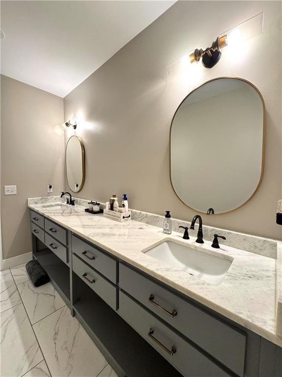112 Three Oaks Dr SE, Calhoun, GA 30701 - bathroom with double vanity and marble finish floors