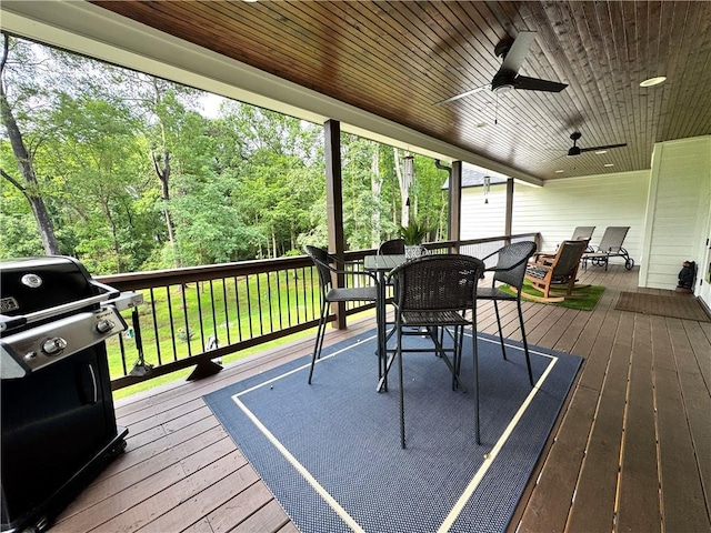 112 Three Oaks Dr SE, Calhoun, GA 30701 - wooden terrace with grilling area, outdoor dining area, ceiling fan, and a lawn