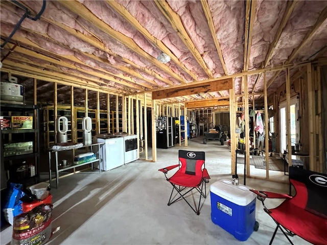 112 Three Oaks Dr SE, Calhoun, GA 30701 - unfinished below grade area with black refrigerator with ice dispenser and washer and clothes dryer