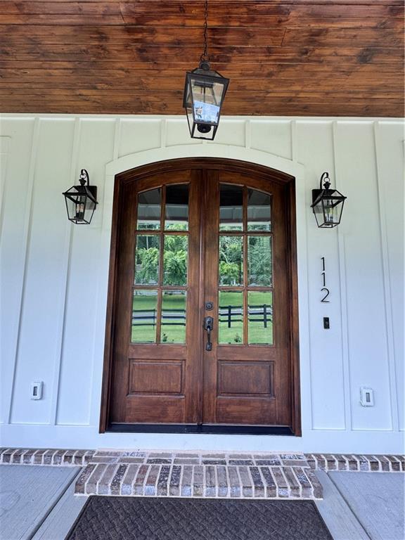 112 Three Oaks Dr SE, Calhoun, GA 30701 - view of exterior entry with french doors