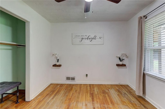122 Vickery Dr, Fairburn, GA 30213 - unfurnished bedroom featuring light wood-style floors, baseboards, a ceiling fan, and a closet