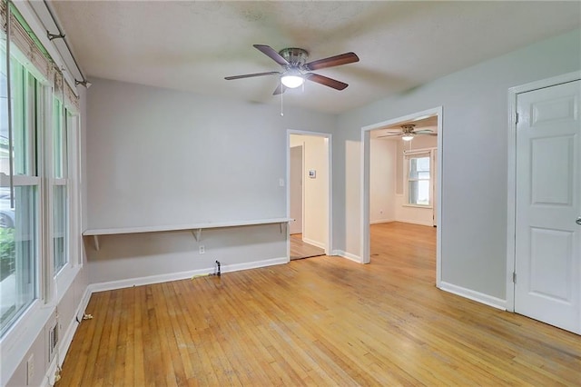 122 Vickery Dr, Fairburn, GA 30213 - spare room with ceiling fan, light wood-style floors, and baseboards