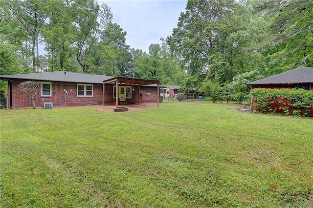 122 Vickery Dr, Fairburn, GA 30213 - view of yard with a pergola, a fire pit, view of scattered trees, and central air condition unit