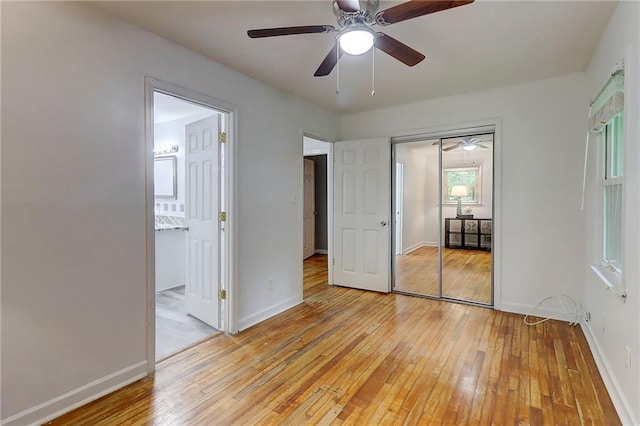 122 Vickery Dr, Fairburn, GA 30213 - unfurnished bedroom featuring light wood-style floors, baseboards, a closet, ensuite bath, and ceiling fan