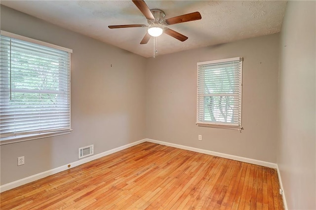 122 Vickery Dr, Fairburn, GA 30213 - empty room with baseboards, wood-type flooring, and a ceiling fan