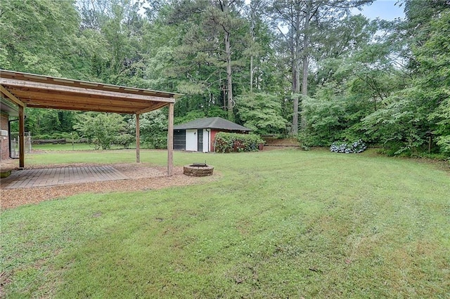 122 Vickery Dr, Fairburn, GA 30213 - view of grassy yard with a fire pit