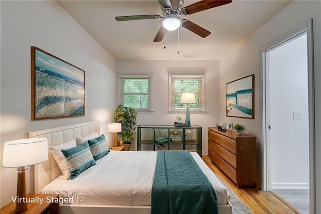 122 Vickery Dr, Fairburn, GA 30213 - bedroom with light wood finished floors, baseboards, and ceiling fan