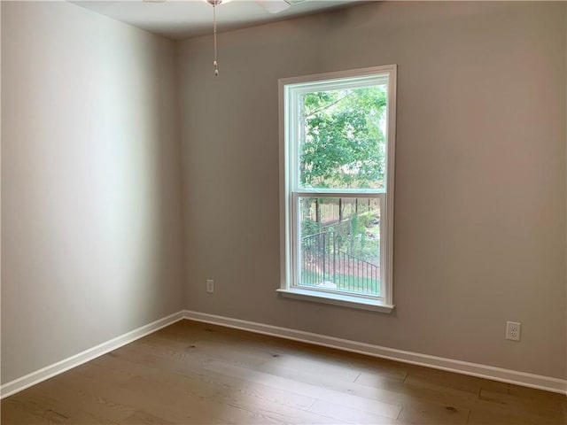 7206 Grand Reunion Dr, Hoschton, GA 30548 - spare room featuring wood finished floors and a ceiling fan