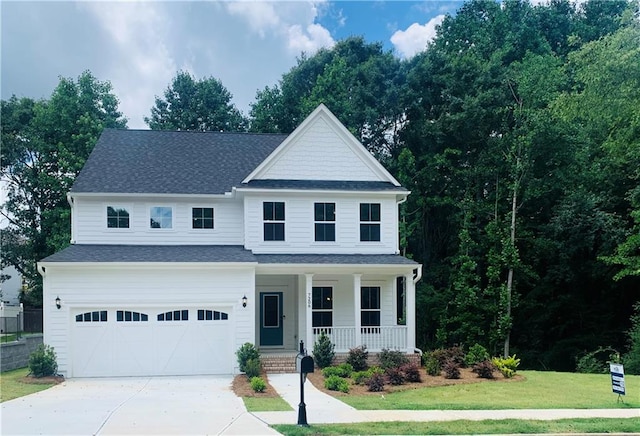 7206 Grand Reunion Dr, Hoschton, GA 30548 - traditional-style home with a porch, an attached garage, driveway, a front yard, and roof with shingles