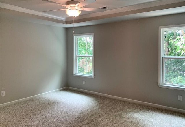 7206 Grand Reunion Dr, Hoschton, GA 30548 - carpeted empty room with healthy amount of natural light, a raised ceiling, and a ceiling fan