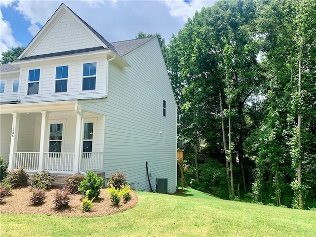 7206 Grand Reunion Dr, Hoschton, GA 30548 - view of home's exterior featuring a porch and a yard