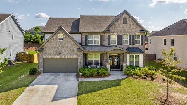 craftsman-style home featuring central air condition unit, covered porch, a front yard, and a garage