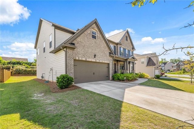 view of front of house featuring a front yard and a garage