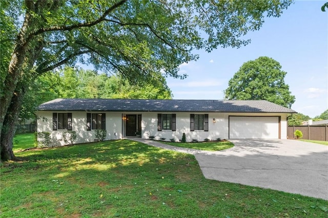 ranch-style house with a garage and a front yard