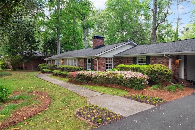 302 Chinquapin Dr SW, Marietta, GA 30064 - single story home with a chimney, brick siding, and a front lawn
