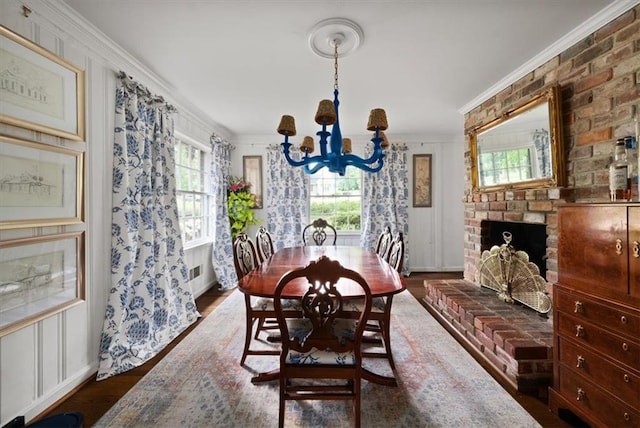 302 Chinquapin Dr SW, Marietta, GA 30064 - dining space with ornamental molding, a chandelier, and dark wood-style floors