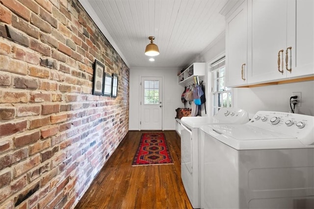 302 Chinquapin Dr SW, Marietta, GA 30064 - laundry room featuring brick wall, cabinet space, washer and dryer, and dark wood-type flooring