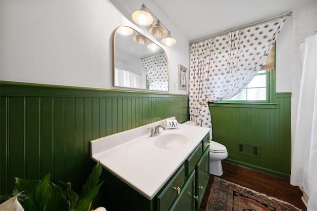 302 Chinquapin Dr SW, Marietta, GA 30064 - bathroom with a wainscoted wall, toilet, vanity, and wood finished floors
