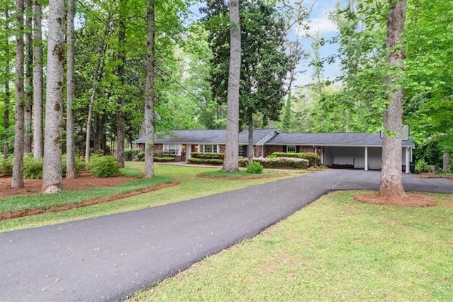302 Chinquapin Dr SW, Marietta, GA 30064 - single story home with asphalt driveway, a carport, and a front yard
