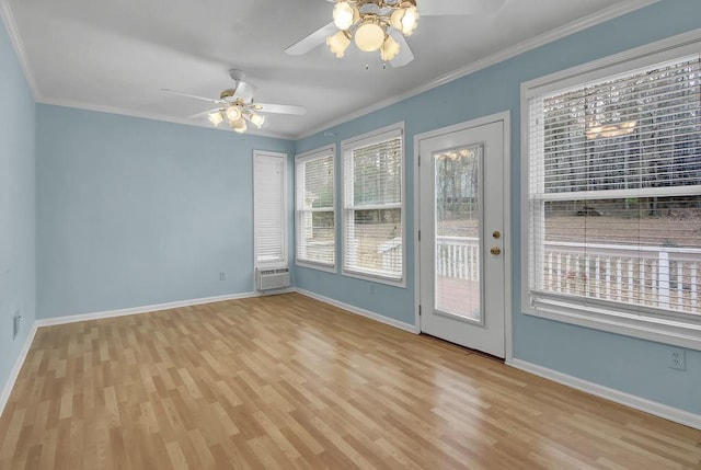 spare room featuring a wall mounted AC, ornamental molding, light hardwood / wood-style floors, and ceiling fan