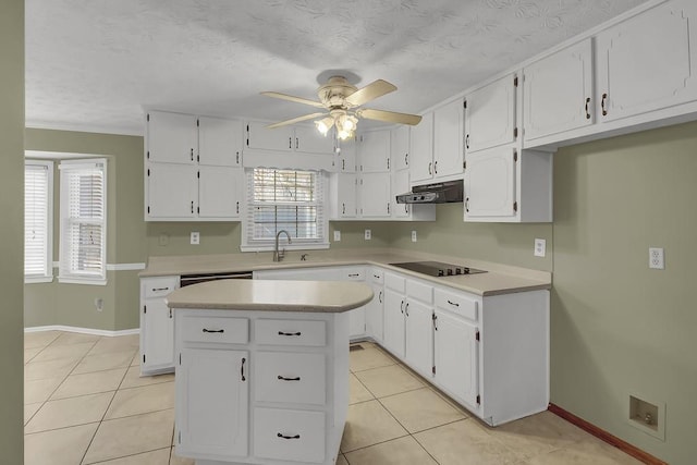 kitchen featuring sink, white cabinetry, a center island, light tile patterned floors, and black electric cooktop