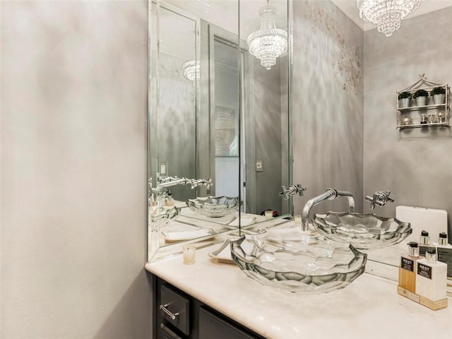 bathroom with vanity and a notable chandelier