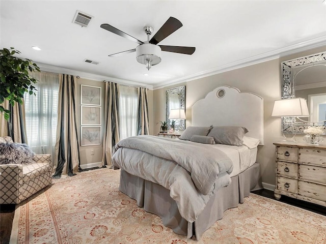 bedroom featuring ceiling fan and ornamental molding