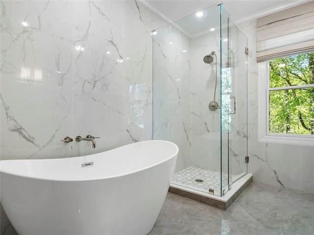 bathroom with ornamental molding, tile walls, and plus walk in shower