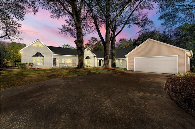 ranch-style house featuring a garage