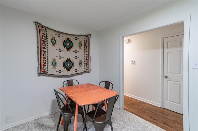 dining area with wood-type flooring